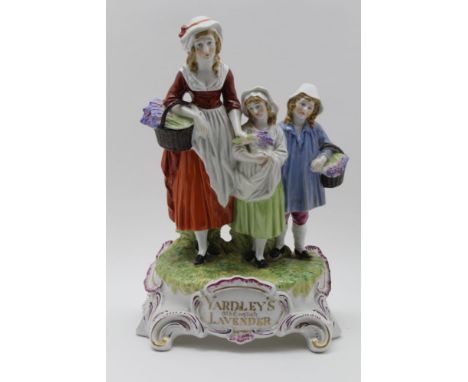 A CERAMIC 'YARDLEY'S OLD ENGLISH LAVENDER' FIGURE GROUP, hand painted on scroll work base, 31cm high 
