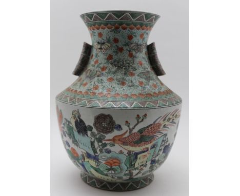 AN EARLY 20TH CENTURY CHINESE CERAMIC VASE having bamboo design twin lug handles, all-over decorated with flora & fauna, in t