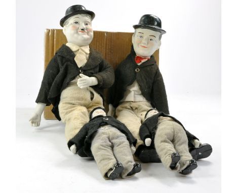 Laurel and Hardy group of four ceramic dressed figures, two different sizes as shown. Look to be complete with no obvious fau