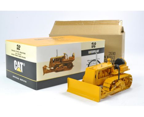 Spec Cast 1/16 Construction issue comprising CAT D2 Crawler Tractor with Tool Bar Blade. ACMOC Special Edition. Has been disp