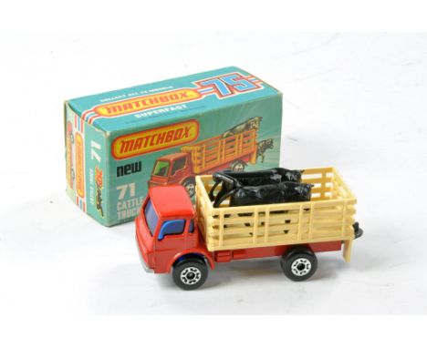 Matchbox Superfast No. 71C Cattle Truck. Red with light tan back, blue windows, black cows still on sprue. Excellent in very 