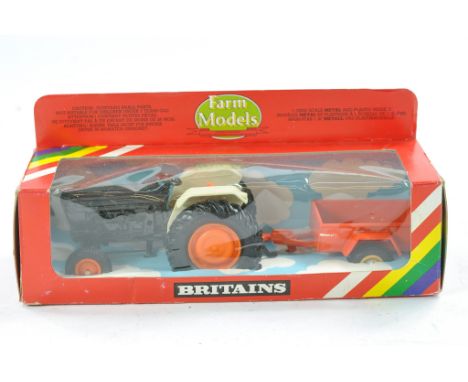 Britains 1/32 farm issue comprising No. 9431 Ford Based Tractor in brown with orange trailer. Excellent with no obvious sign 