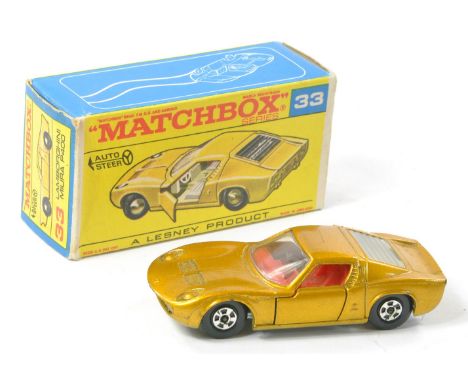 Matchbox Superfast No. 33a Lamborghini Miura. Gold body, clear windows with frosted rear engine cover, red interior and bare 