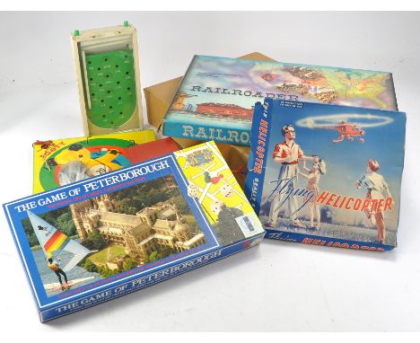 Assorted games including 'Game of Peterborough', Sooty ring toss by Chad Valley, As new Scrabble with outer box and others as