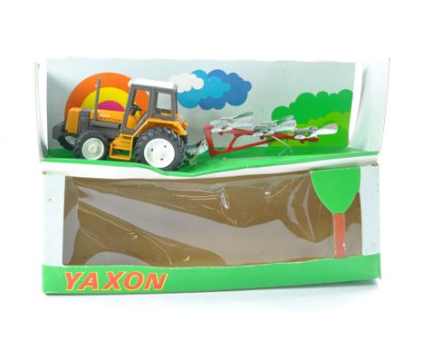 Yaxon 1/43 farm issue comprising Renault 145-14 Tractor with plough. Plough has single mouldboard missing, otherwise excellen