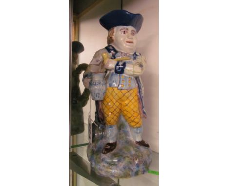 A character jug man holding pipe and jug (hat repaired)