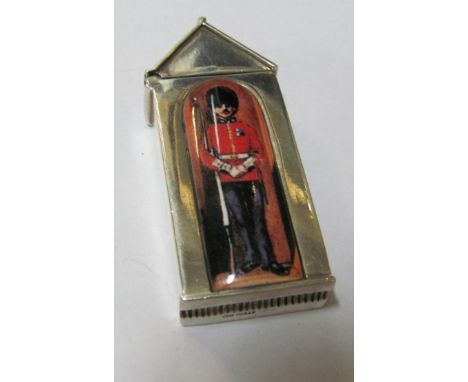 A vesta marked sterling with enamel guardsman