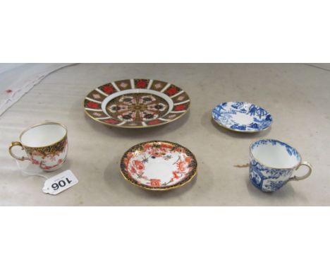 A Royal Crown Derby Imari plate and two coffee cups and saucers