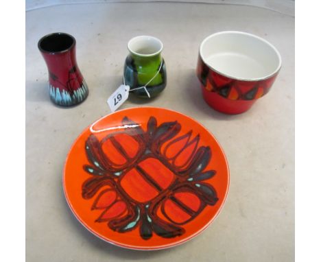 A 1970s Poole Pottery plate, plant pot and two small vases