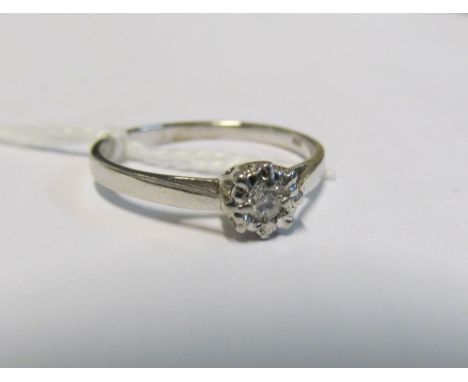 A single stone diamond illusion set ring