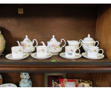 Two Royal Albert 'Moss Rose' teapot and a Wedgwood Mirrabelle four cups, saucers, lidded sugar and jug