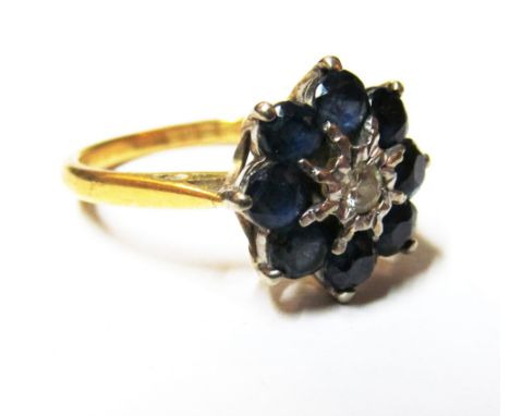 An 18ct gold sapphire and diamond illusion cluster ring