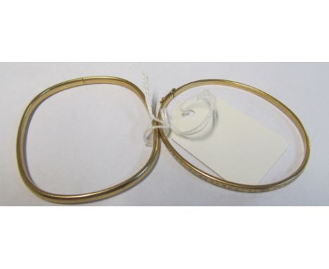 A 9ct gold engraved bangle 3.3gm and another marked 9kt (total of both 8.4g)