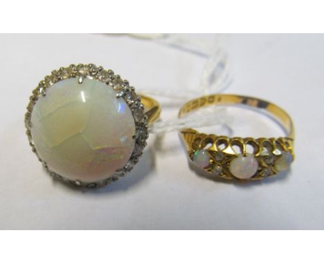 A large circular opal and diamond ring on platinum and 18ct gold band, size N/O (cracked) and another opal and diamond ring o