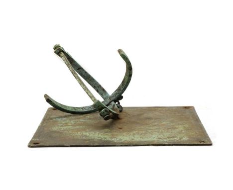 A 17th century style sundial, c.1900, with complex gnomen and cast with Dolphin finial, 25.5cm wide, 18cm highCondition repor