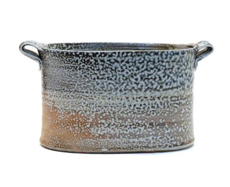 Anne Mette Hjortshøj (Danish, b.1973), a salt glazed planter, of oval form, with slightly concave sides, with folded handles 