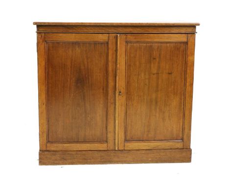 An early Victorian mahogany side cabinet, with two panelled doors, raised on plinth base, stamped VR below a crown, purported