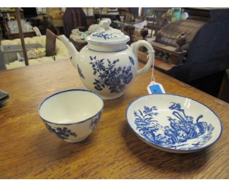 18th century Worcester blue and white teapot and cover, a Caughley tea bowl, each decorated in a floral pattern, and a Caughl