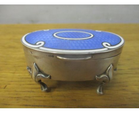 A George V silver and enamelled ring box of oval form, the top with blue guilloche enamel and white oval band and edge border