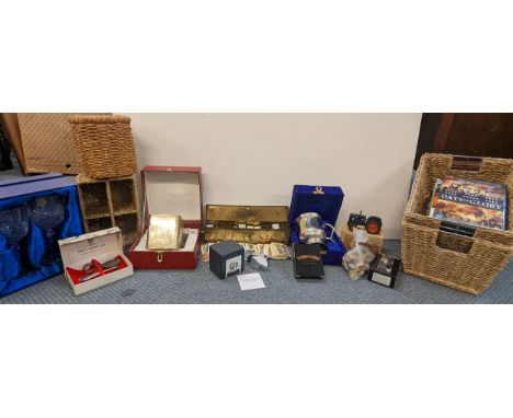 A mixed lot of items to include a boxed Georg Jensen Elephant bottle opener, boxed model of a tractor, mixed DVD's, wicker st