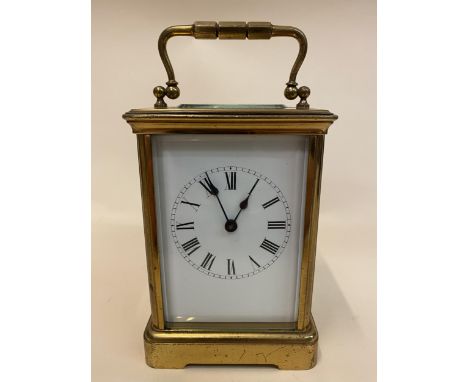 A 19th century French Richard & Cie brass carriage clock having a white enamel dial, Roman numerals and blued hands, the back