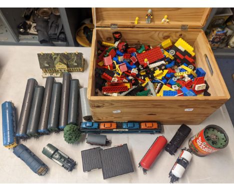 A wooden box of mixed Lego with mini figures, together with Lima model railway carriages and engines, along with model buildi
