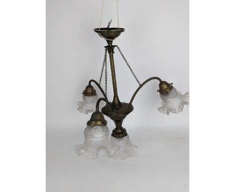 Art Nouveau four light electrolier/chandelier, the brass frame, three carved branches and chains fitted with original opaque 