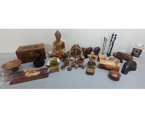 A mixed lot of treen ornaments to include a model of the Buddha, hippos, mushrooms and others, together with an Oriental styl