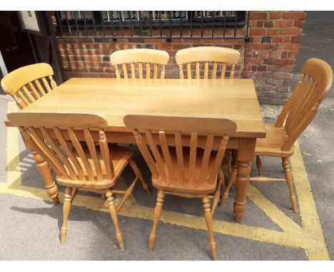 A light oak Stewart Linford dining table, together with six matching dining chairs Location: RTAF 