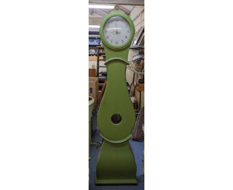 A 19th century and later Swedish 'Mora' longcase clock having a green painted pine case and circular, 11.5" dial, 199cm hLoca