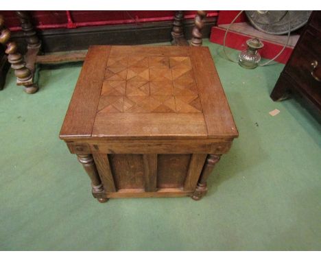 An oak commode with geometric cubed top, panel and column sides, 41cm x 42.5cm x 42.5cm 
