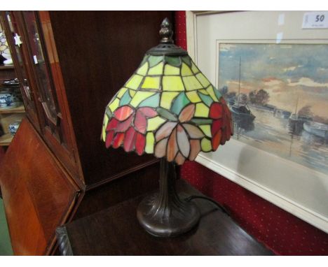 A Tiffany style table lamp with stained glass floral shade, tree form base, 36cm high overall 