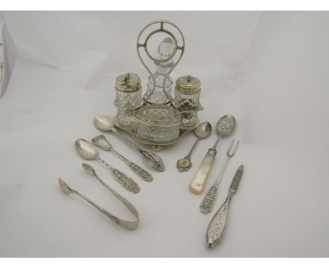 A Scandanavian silver spoon, olive fork and another spoon, a small silver spoon and related. A plated cruet set on stand 