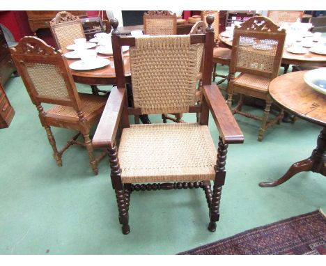 An 18th Century style elbow chair with sea grass back rest and seat over bobbin turned legs and 'H' stretchers 