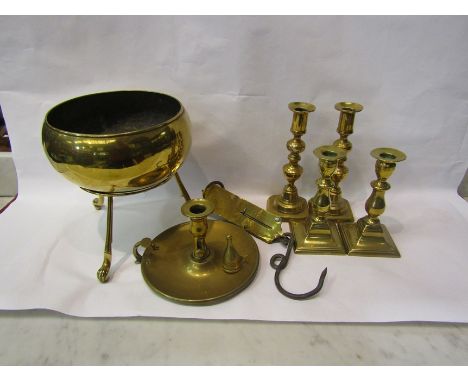 Two pairs of brass candlesticks, a Salter's spring balance scale, a brass chamberstick and heavy brass bowl on stand 