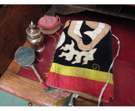 Three Tibetan items including dance apron, a brass and copper inkwell and handheld drum (3) 