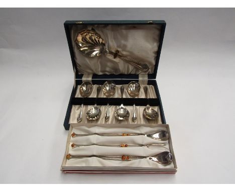 A cased set of EPNS shell design spoons and cased pickle fork and spoon, stamped MFT 
