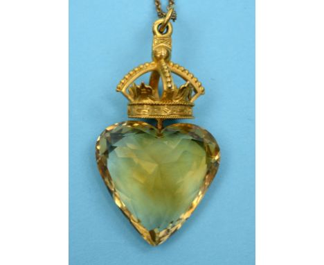 A yellow coloured metal, citrine, ruby and emerald pendant, the large heart shape citrine suspended from yellow coloured meta