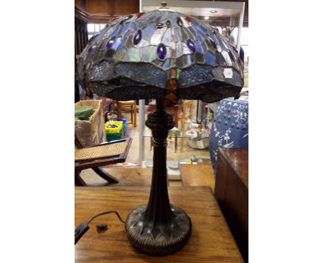 A Tiffany style table lamp, with a coloured glass shade decorated dragonflies, 70 cm high