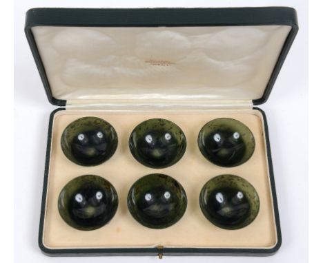 A set of six spinach jade tea bowls, each 6 cm diameter, in a H Simmons, Burlington Arcade case  See illustration Condition r