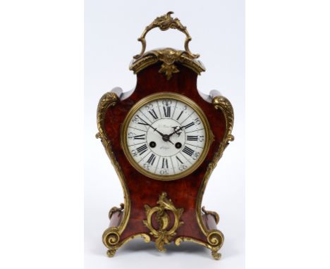 A Louis XV style French mantel clock, the 12.5 cm diameter dial signed Ed Smeton (?), Liege, with Roman numerals, in a tortoi