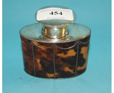 A silver tea caddy, of oval form, applied faux tortoiseshell, 8 cm high