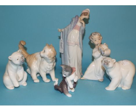 A Lladro polar bear, seated, 11 cm high, a similar polar bear, two Lladro figures, a kitten and mouse, and a Nao cat (a.f.) (