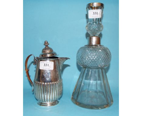A silver hot water jug, initialled, Sheffield 1890, approx. 8.4 ozt (all in), 17 cm high, and a silver mounted thistle decant