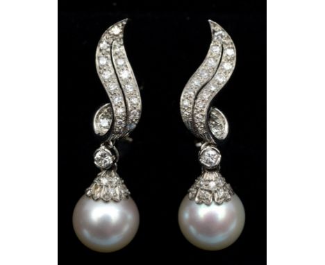 A pair of pearl and diamond drop earrings, in a white coloured metal setting  See illustration Condition report Report by NG
