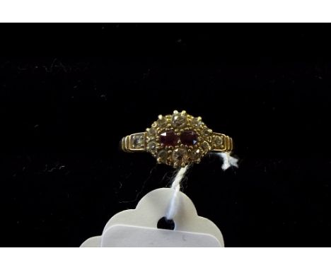An 18ct gold, ruby and diamond ring
