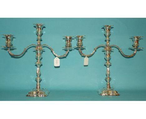 A pair of filled silver three light candelabra, Sheffield 1979, the branches approx. 52.0 ozt, 36.5 cm high (2)