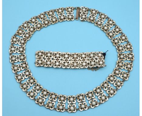 A Norwegian silver and white enamel necklace, in the form of stylised flowerheads, David Andersen, with a matching bracelet  