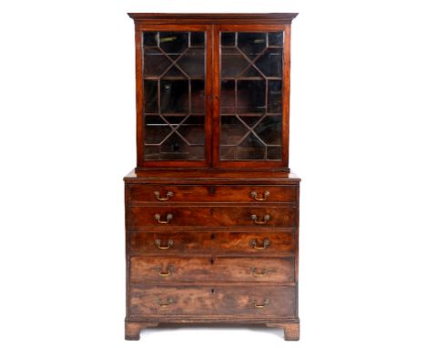 A mahogany secretaire bookcase, having a pair of bar glaze doors above a secretaire door, with three further long drawers bel