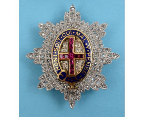 A Guards regimental sweetheart brooch, with enamel motto set rubies and diamonds, in a fitted Edward box  See front cover col